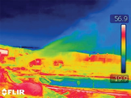 A pollution plume lofting into the atmosphere above a containment pond. Wet-bulb temperature is green colored. Blue is below wet bulb, indicating no water is left. The resulting dry particulate can be blown by the wind across a wide geographic area.