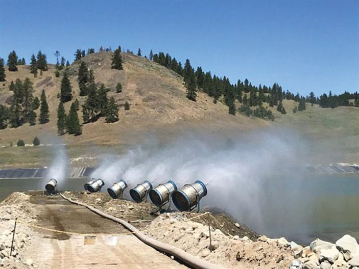 Landshark land-based evaporator units from RWI Enhanced Evaporation deployed around a coal ash pond to prevent the spread of particulate matter.